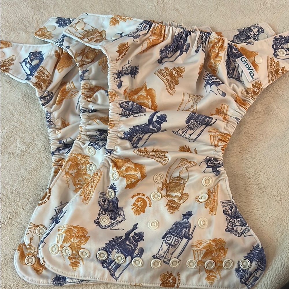 3 Smokey the Bear Hybrid Diaper shells 
9 organic no prep soaker pads